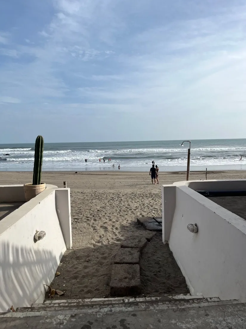 Steps down to the surf and open sand